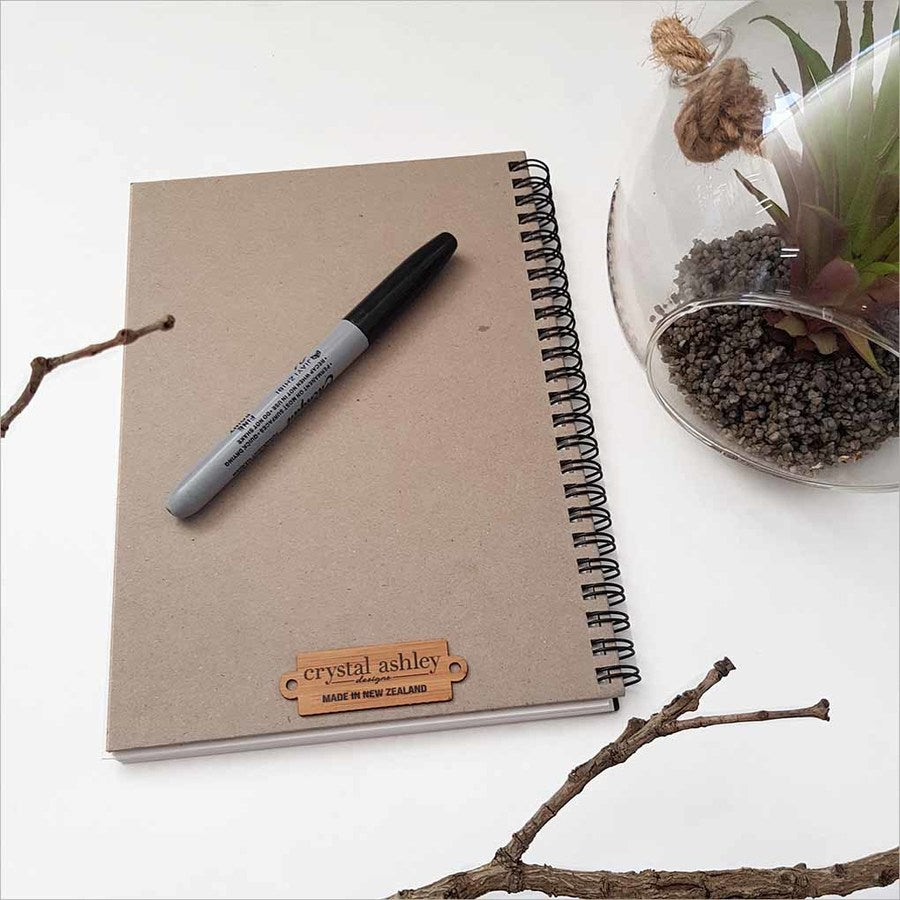 Kiwiana Black Journal featuring a King Fisher on koru design, perfect for journaling and capturing inspiration.