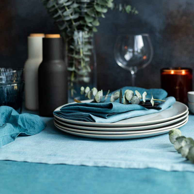 Elegant Baksana linen tablecloth in vibrant Peacock color, measuring 160 x 300 cm, perfect for stylish dining experiences.