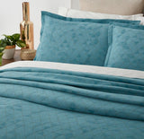 Nelle Bedspread for Super King with blue geometric pattern and gold accents, includes 2 matching Oxford pillowcases.