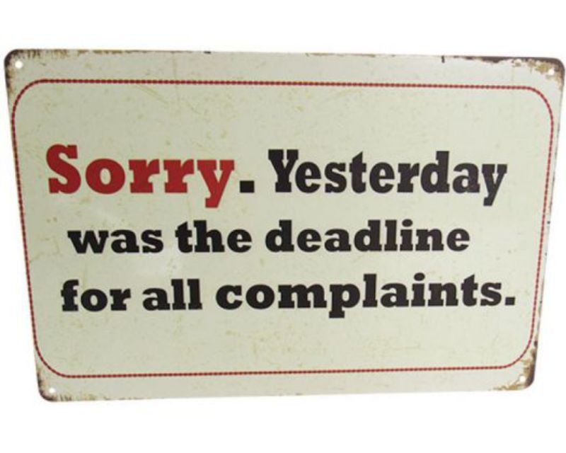 Retro tin sign featuring humorous 'Sorry Complaints' quote, perfect for home or office decor.
