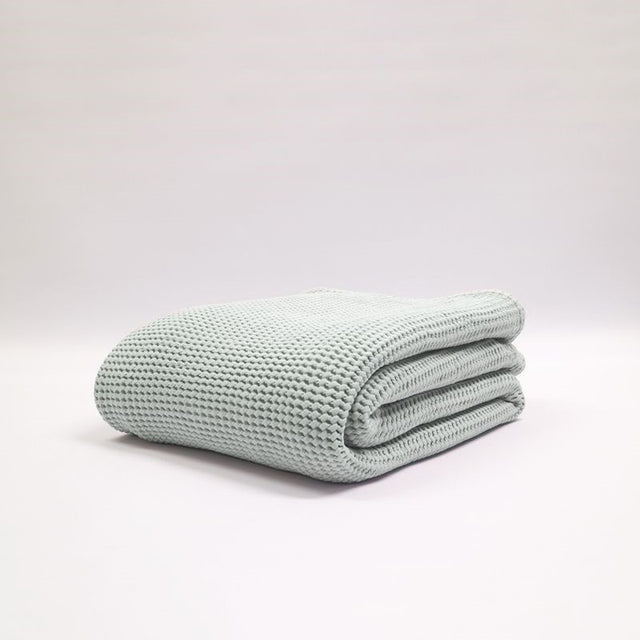 Large stonewashed duck egg blanket with a bouncy waffle texture, made from 100% certified cotton by Baksana.