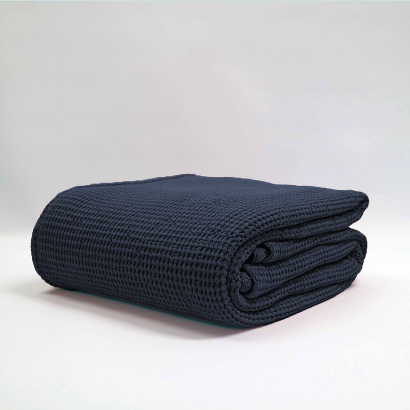 Navy stonewashed Baksana New Bliss Blanket, large size 240x260 cm, featuring a bouncy waffle texture, ethically made from cotton.