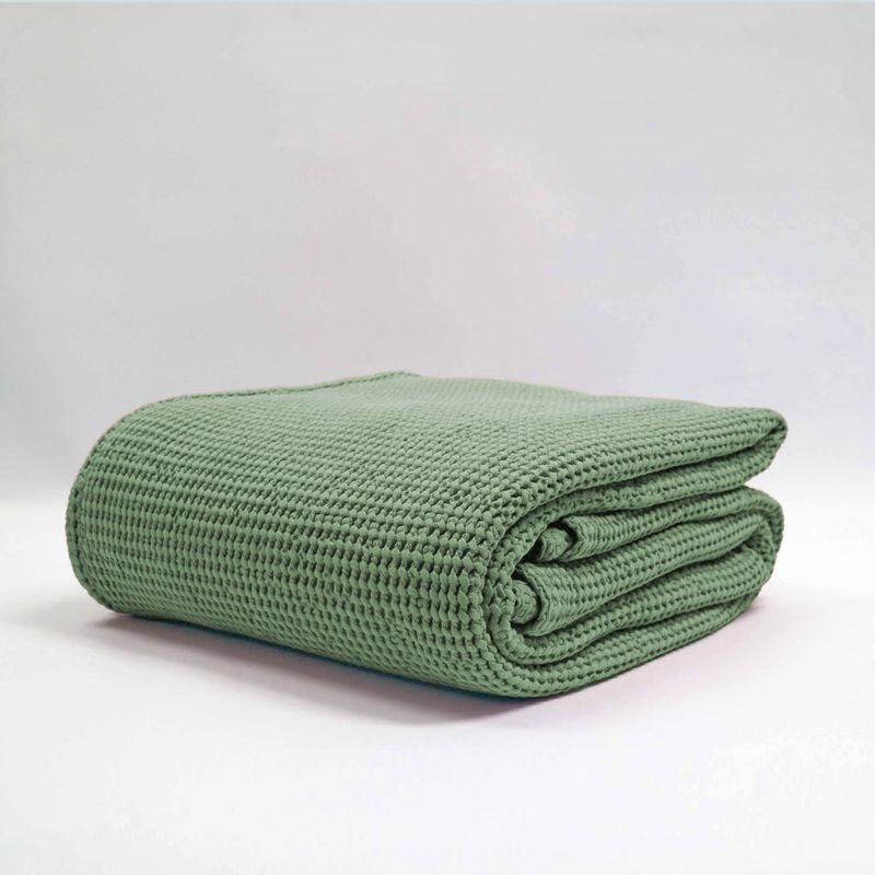 Large sage stonewashed blanket with bouncy waffle texture, made from 100% OEKO-TEX® certified cotton.