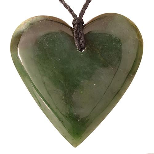 Handcrafted Greenstone Heart Pendant showcasing rich M?ori heritage, made from premium Nephrite Jade, on a braided black cord.