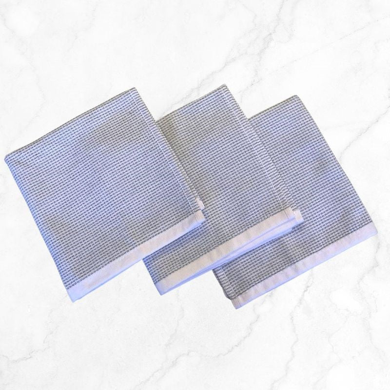 Set of 3 grey dish cloths from BAKSANA, made of 100% cotton, stylish and absorbent for kitchen cleaning needs.