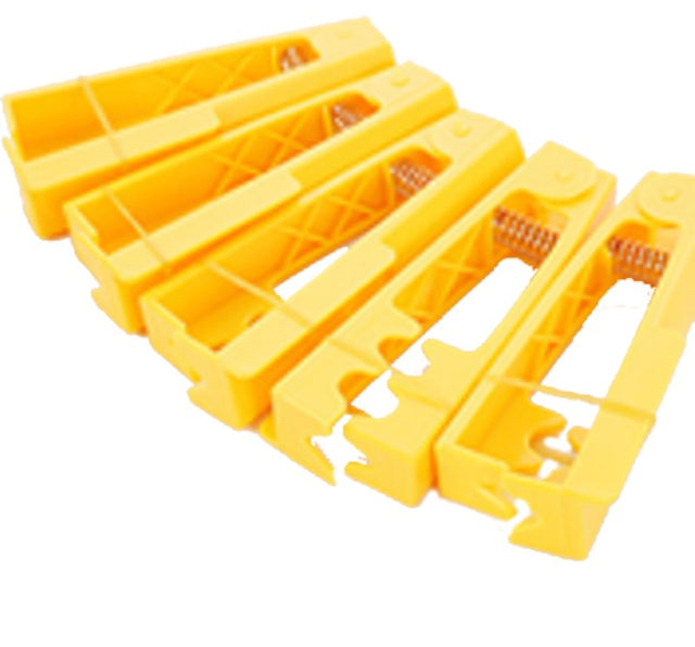 Yellow plastic rose stripper for removing thorns and leaves, essential for efficient floral design.