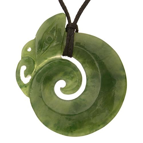 Intricately carved Jade Manaia Koru Pendant in Nephrite Jade, symbolizing protection and new beginnings, on a black wax cord.