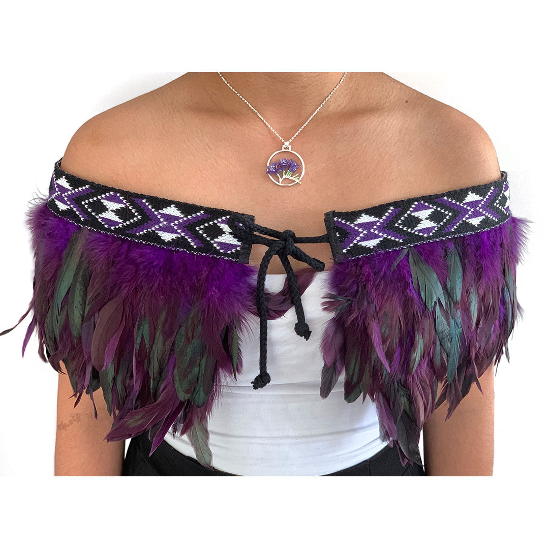 Elegant purple Korowai Cape featuring vibrant feather details, perfect for special occasions and crafted with Maori artistry.