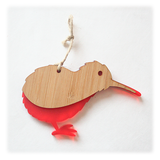 Vibrant red Kiwi Ornament made from bamboo and satin acrylic, perfect for holiday decor or gifting, measuring 139mm x 93mm.