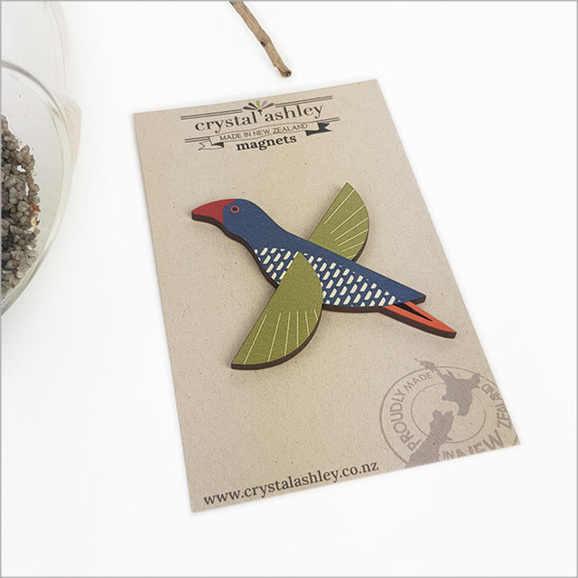 Folk Pukeko magnet showcasing vibrant blue and purple design, perfect for holding notes or adding Kiwi charm to decor.