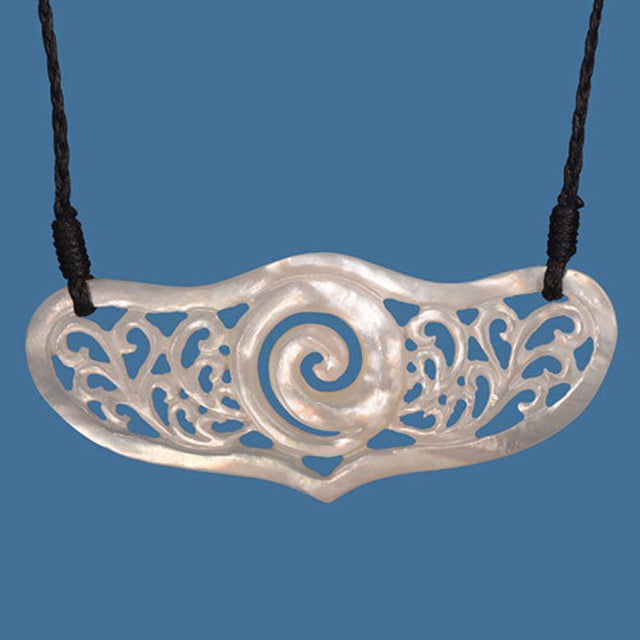 Elegant MOP Breastplate Necklace featuring intricate koru detailing on a braided cord, symbolizing growth and heritage.