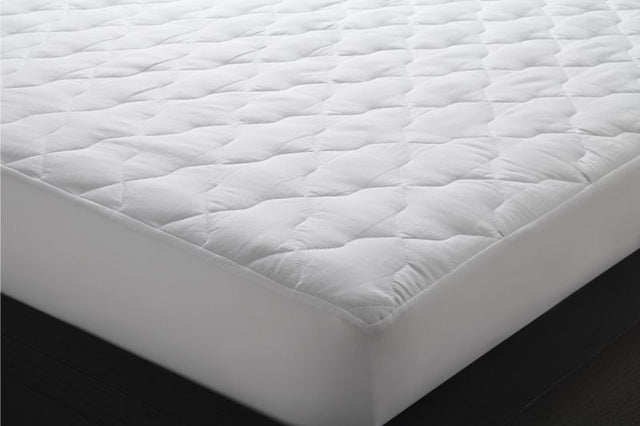 Quilted double mattress protector by Logan & Mason in white, featuring soft cotton cover and secure fit for enhanced comfort.