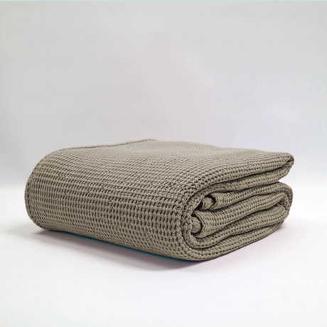 Large stonewashed beige blanket with a deep waffle texture, made from 100% OEKO-TEX® certified cotton.