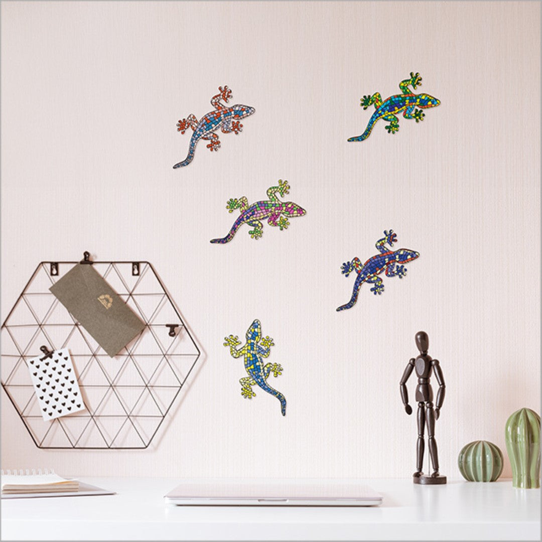 Colorful laser-cut gecko wall art set from New Zealand, perfect for playful home decor and easy to rearrange.