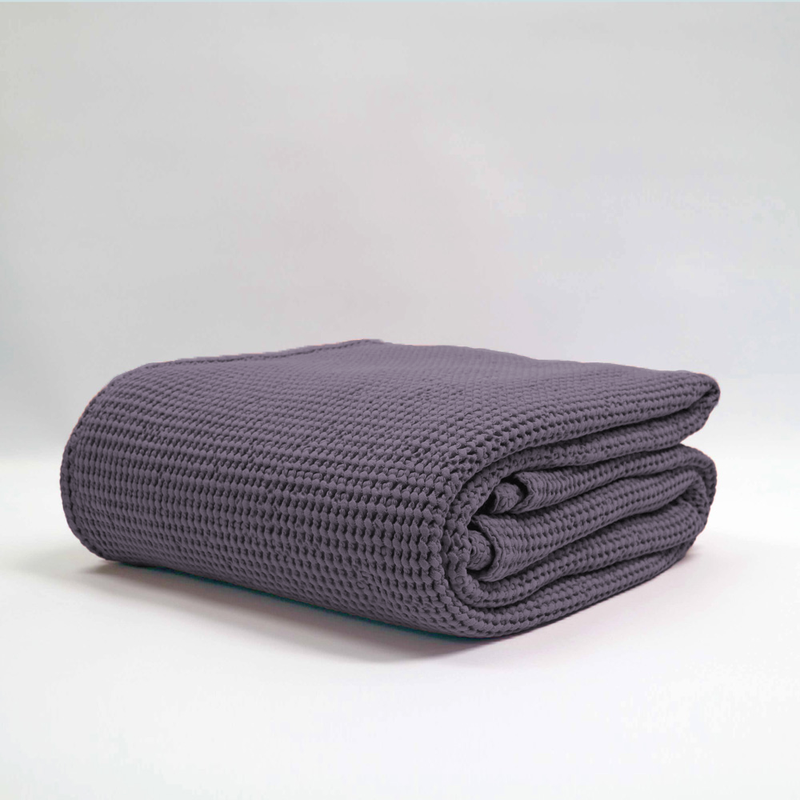 Large grape-colored stonewashed blanket with textured waffle design, made from 100% OEKO-TEX® cotton.