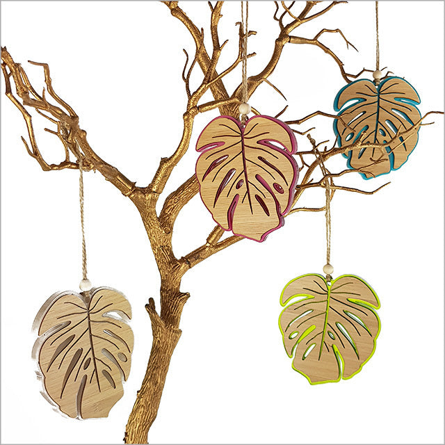 Vibrant yellow satin Monstera hanging ornament, 104mm, crafted from laser-cut bamboo, perfect for tropical home decor.