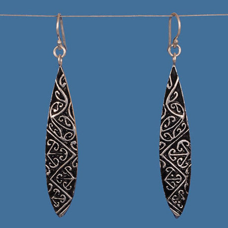 Stylish Maori Design Earrings in silver-plated brass, showcasing intricate cultural patterns for everyday elegance.