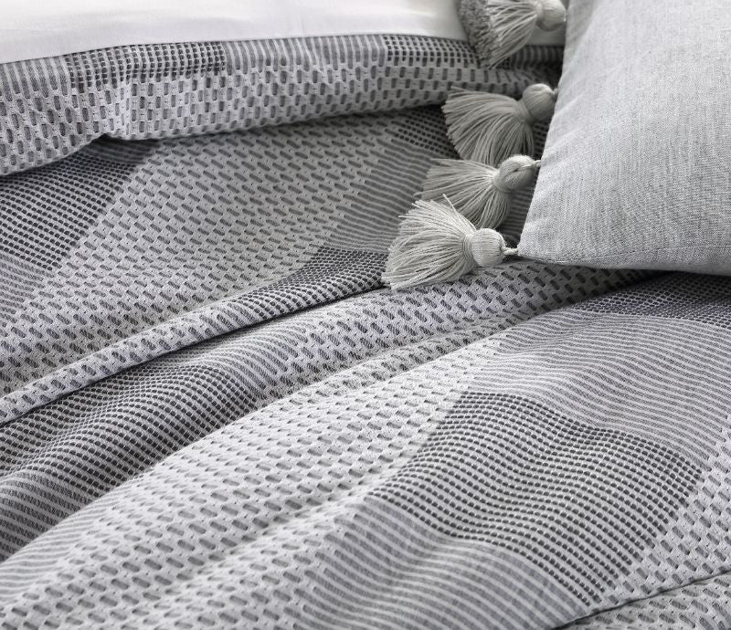 Queen duvet cover set in Subi Grey featuring soft 100% cotton jacquard fabric and matching pillowcases for elegant bedding.