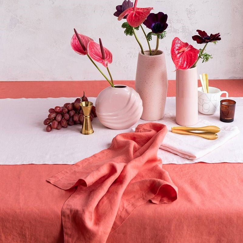 Salmon linen tablecloth by Baksana, 160 x 240 cm, enhancing dining with elegance and warmth.