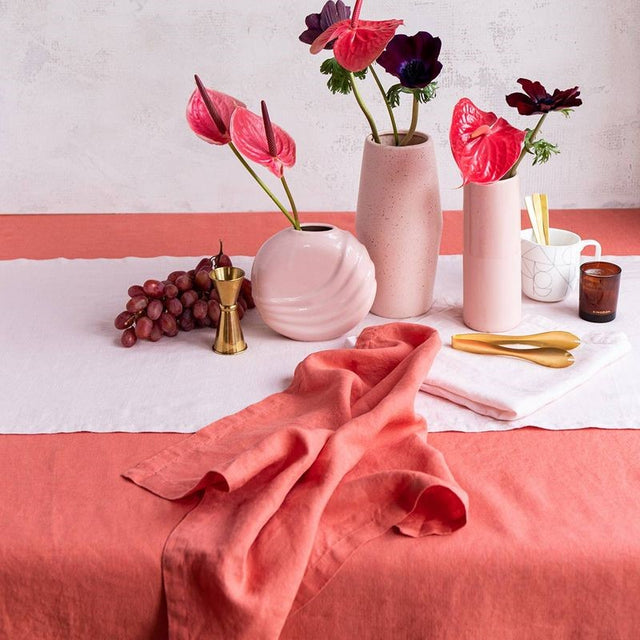 Salmon linen tablecloth by Baksana, 160 x 240 cm, enhancing dining with elegance and warmth.