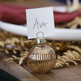 Elegant gold ribbed glass bauble place card holders, set of four, perfect for upscale dining and events.