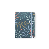 A5 refillable notebook with a botanical blue cover, featuring lined pages and a durable twin-wire binding for flat writing.