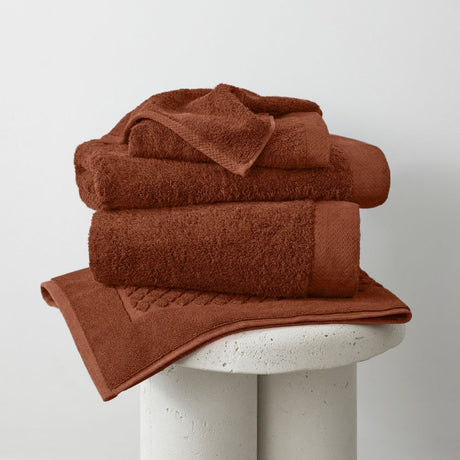 Eco-friendly rust orange bamboo bath towel, 70 x 147cm, super absorbent and gentle on sensitive skin.