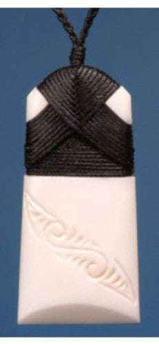Small engraved Toki pendant symbolizing strength and courage, showcasing New Zealand's rich Maori heritage.