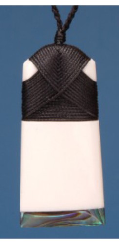 Small Toki pendant in bone with Paua shell inlay, symbolizing Maori strength and crafted with cultural artistry.