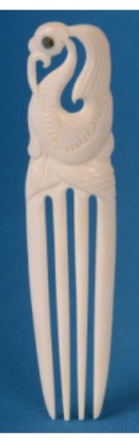 Handcrafted large Manaia hook comb featuring unique paua inserts, symbolizing protection and heritage from New Zealand.
