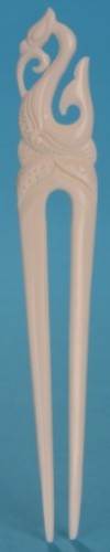 Handcrafted small bone comb featuring unique Manaia design, symbolizing protection and good fortune, celebrating Kiwiana culture.