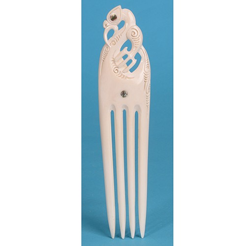 Extra large Heru comb features unique bone carving with paua shell inlays, symbolizing protection and M?ori heritage.
