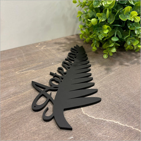 Elegant black acrylic wall art featuring the Silverfern, ideal for modern decor and easy mounting.