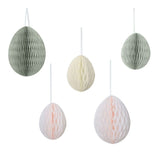 Colorful honeycomb egg decorations for Easter, featuring cream, light pink, and sage green, perfect for festive hanging.