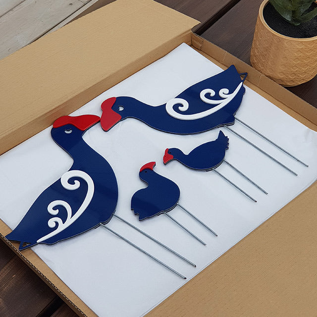 Whimsical Pukeko family garden stakes set showcasing vibrant adult and chick figures, crafted in durable ACM and acrylic.