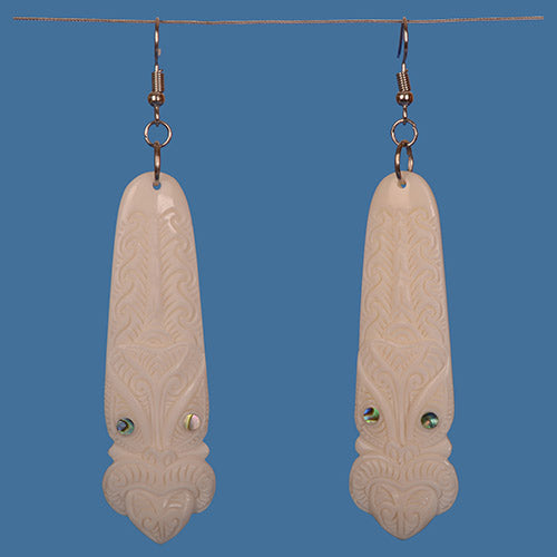 Bone Toki Earrings featuring a Tiki Pattern, handcrafted from beef bone with paua shell accents, measuring 95mm long.