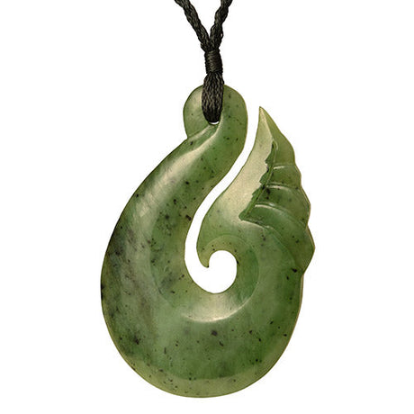 Large greenstone hook pendant crafted from nephrite jade, symbolizing good fortune and safe travels, presented in a gift box.