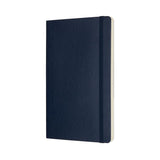 Large sapphire blue Moleskine notebook with soft cover, dot grid pages, and elastic closure for creative note-taking.