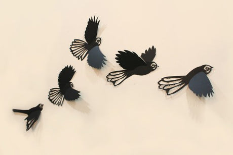 Elegant wall art featuring five laser-cut polypropylene fantails in flight, ideal for indoor or outdoor decor.