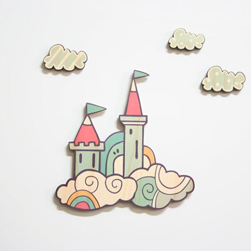 Handcrafted pine wall art set featuring a whimsical castle and three clouds for enchanting home decor.