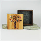 Small wooden trinket box with birds on a tree design, crafted from NZ Silver Beech veneer and featuring paua inlay.