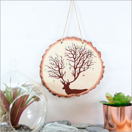 Wood slice wall art featuring a charming Christmas deer design, perfect for holiday decor in any style.