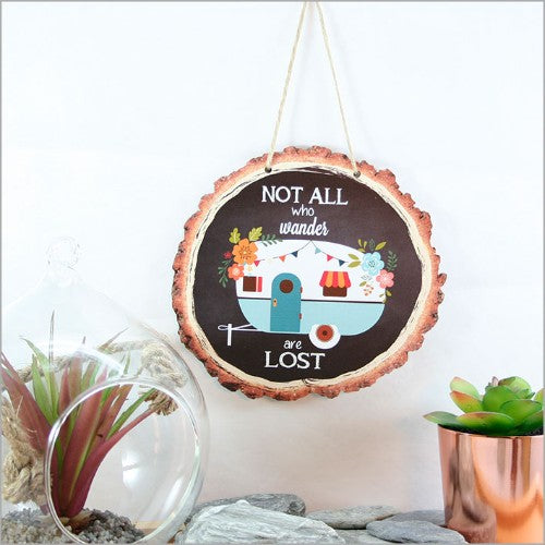 Rustic wood slice wall art featuring a caravan design, perfect for unique home decor and inspiring adventure.