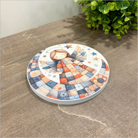 Small canvas circle featuring a whimsical patchwork angel design, perfect for unique home decor and easy hanging.
