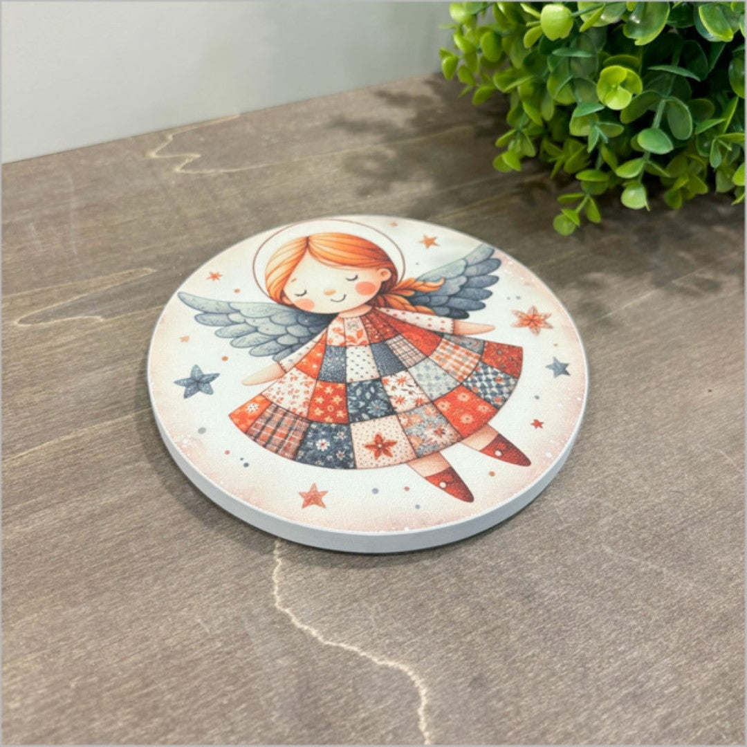 Small embossed canvas circle featuring a whimsical angel design, perfect for charming home decor and easy hanging.