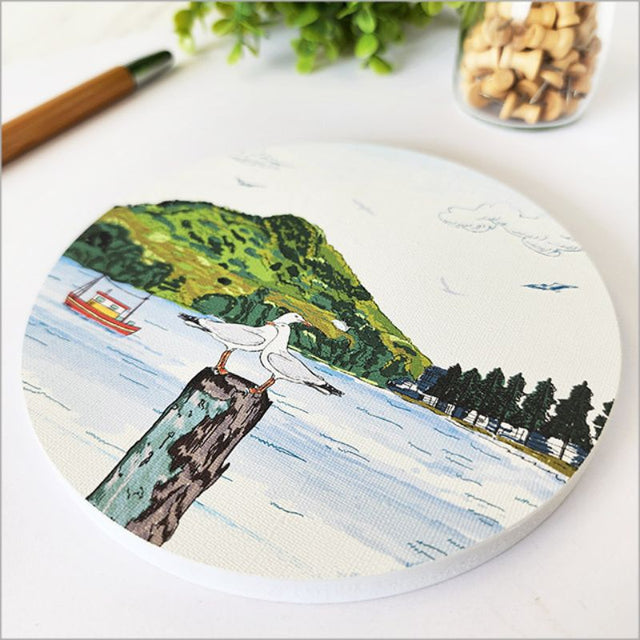 Stunning circular canvas wall art featuring Mount Maunganui's landscape, 150mm diameter, ready to hang.