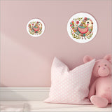 Large canvas circle wall art featuring a vibrant pink patchwork bird design, perfect for nurseries and playrooms.