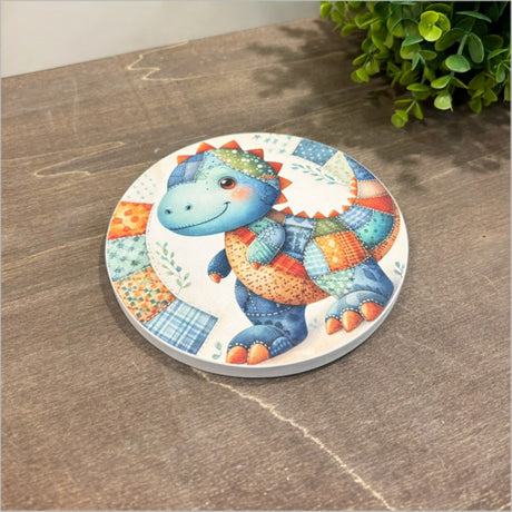 Whimsical dinosaur patchwork design canvas circle, perfect for children's rooms, 150mm diameter, ready to hang.