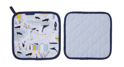 Cotton Pot Mat featuring a seaside design with fishermen, gulls, and beach huts, offering heat protection and style.