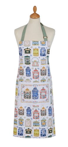 Stylish Ulster Weavers cotton apron featuring eclectic hand-painted tea tins design, adjustable ties, and practical pocket.